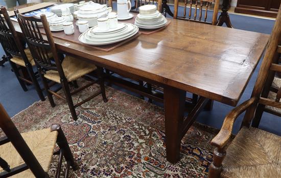 A 17th century style elm planked topped refectory table L.268cm